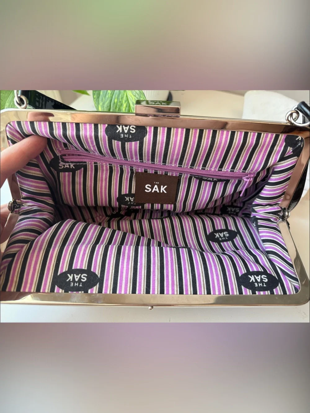 The SAK Black Woven Frame Clutch/Handbag with Bow Accent
